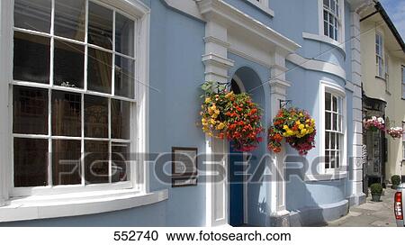 Flower on entrance of building, Pilton, Barnstaple, Devon, England View Large Photo Image Stock Image - Flower on entrance of building, Pilton, Barnstaple, Devon, England . Fotosearch