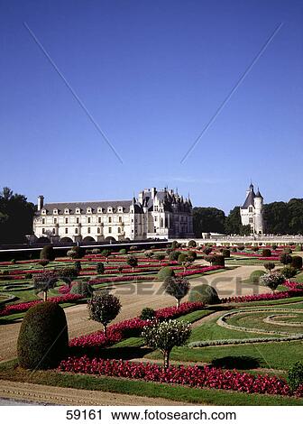 Flowering plants in garden in front of castle, France, Europe View Large Photo Image Stock Image - Flowering plants in garden in front of castle, France, Europe . Fotosearch
