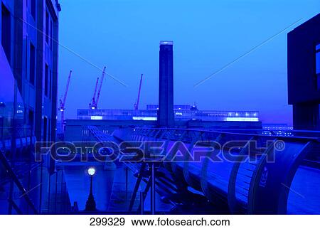 Footbridge across river at dusk, Millennium Bridge, Tate Modern, Thames River, London, England View Large Photo Image Stock Photo - Footbridge across river at dusk, Millennium Bridge, Tate Modern, Thames River, London, England . Fotosearch