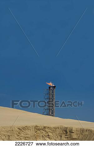 Stock Photo - Gas oil flare at refinery, Qatar . Fotosearch