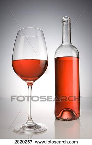 Stock Photo - glass and bottle of red wine, close-up . Fotosearch