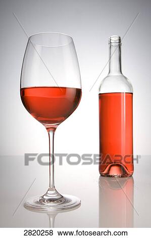 glass and bottle of red wine, close-up View Large Photo Image Stock Photo - glass and bottle of red wine, close-up . Fotosearch