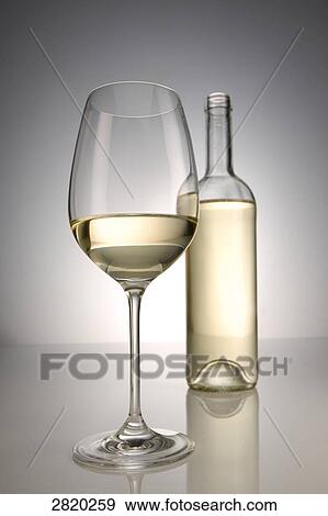 Stock Photo - glass and bottle of white wine, close-up . Fotosearch