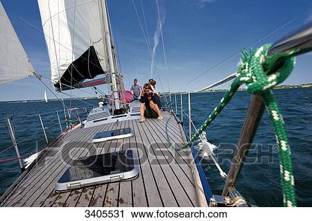 Stock Image - Group of people on a sailing trip . Fotosearch