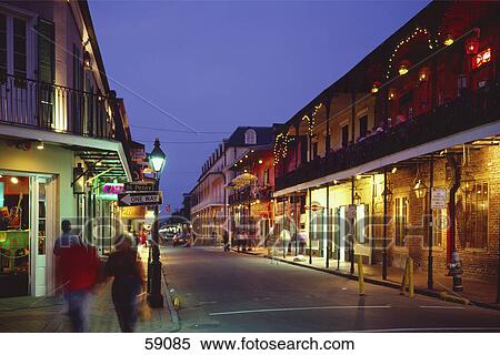 Group of people walking along illuminated street, Bourbon Street, New Orleans, Louisiana, USA View Large Photo Image Stock Photography - Group of people walking along illuminated street, Bourbon Street, New Orleans, Louisiana, USA . Fotosearch