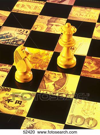 Stock Image - High angle view of chess pieces on chessboard . Fotosearch