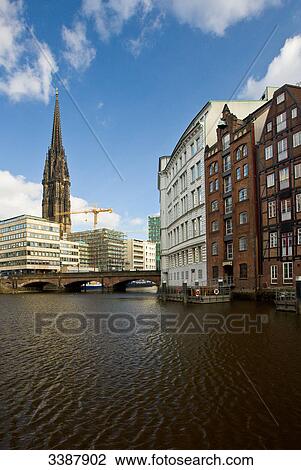 Houses at Nikolaifleet, Nikolai Church in the background, Hamburg, Germany View Large Photo Image Stock Image - Houses at Nikolaifleet, Nikolai Church in the background, Hamburg, Germany . Fotosearch
