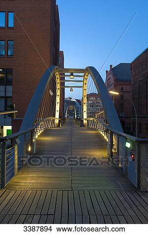 Illuminated footbridge in the old warehouse district (Speicherstadt), Hamburg, Germany View Large Photo Image Picture - Illuminated footbridge in the old warehouse district (Speicherstadt), Hamburg, Germany . Fotosearch