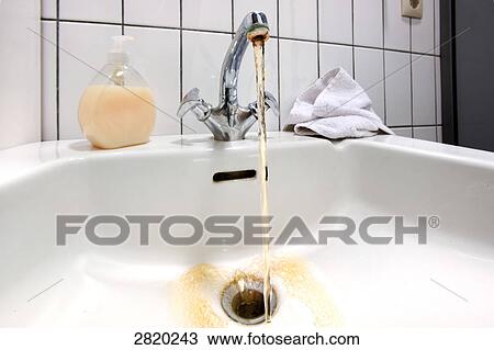 Stock Image - jet of water out of tap, close-up . Fotosearch