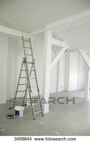 Ladder and paint bucket in an empty attic flat View Large Photo Image Picture - Ladder and paint bucket in an empty attic flat . Fotosearch