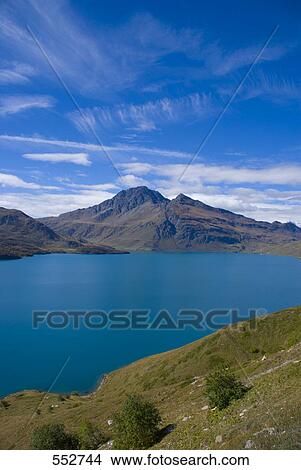 Picture - Lake in front of mountain, Mt Cenis lake, Mt Cenis, Maurienne Valley, Savoie, Rhone-Alpes, France . Fotosearch