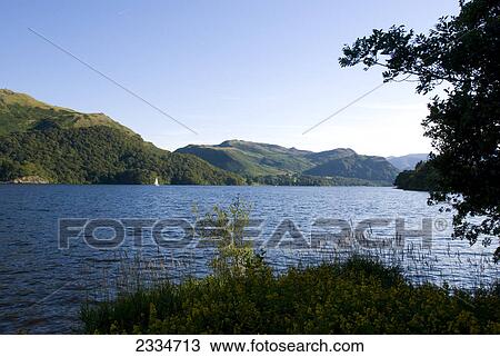Lake in front of mountains, Ullswater, English Lake District, Cumbria, England View Large Photo Image Stock Image - Lake in front of mountains, Ullswater, English Lake District, Cumbria, England . Fotosearch