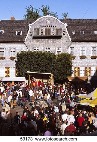 Stock Image - Large group of people at market place in front of city hall, Saxony, Germany, Europe . Fotosearch