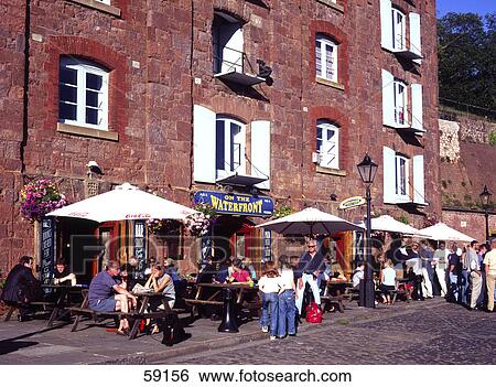 Large group of people at sidewalk cafe, Devon, France, Europe View Large Photo Image Stock Photograph - Large group of people at sidewalk cafe, Devon, France, Europe . Fotosearch
