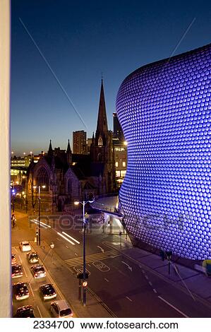 Lit up building with church in background at night, Selfridges Building, St Martins Church, Birmingham, England View Large Photo Image Stock Image - Lit up building with church in background at night, Selfridges Building, St Martins Church, Birmingham, England . Fotosearch