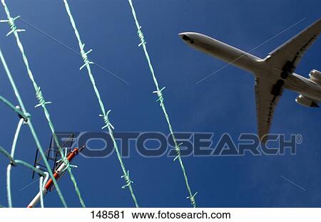 Low angle view of airplane in flight View Large Photo Image Stock Image - Low angle view of airplane in flight . Fotosearch