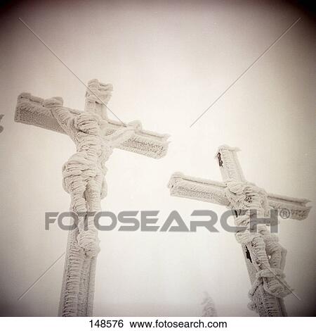 Stock Photograph - Low angle view of crucifix, Bischofsheim, Germany . Fotosearch