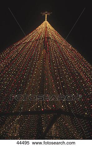 Stock Photography - Low angle view of decorated Christmas tree, Greece, Europe . Fotosearch