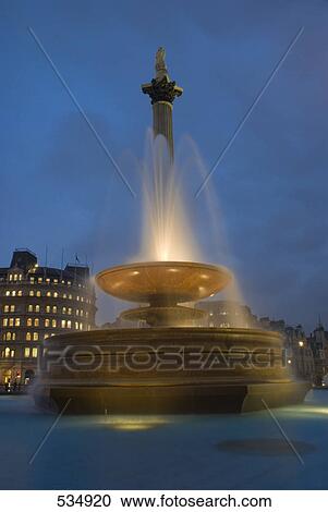 Low angle view of fountain at dusk, Nelsons Column, Trafalgar Square, City Of Westminster, Greater London, London, England View Large Photo Image Stock Image - Low angle view of fountain at dusk, Nelsons Column, Trafalgar Square, City Of Westminster, Greater London, London, England . Fotosearch