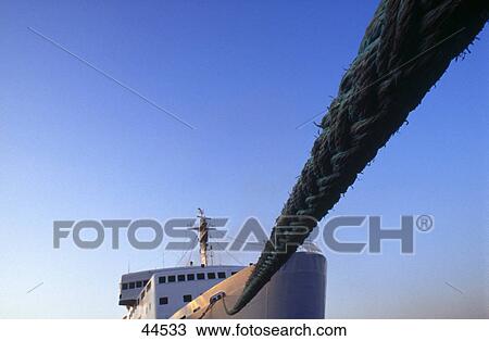 Stock Image - Low angle view of rope and ship . Fotosearch