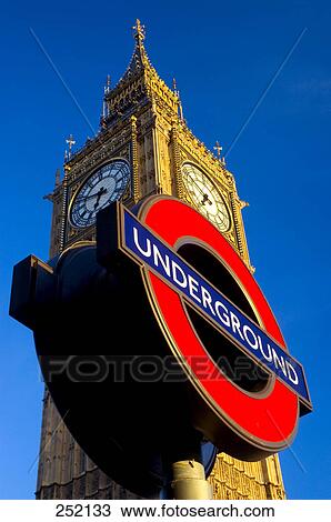 Low angle view of Underground sign in front of tower, Big Ben, London, England View Large Photo Image Stock Image - Low angle view of Underground sign in front of tower, Big Ben, London, England . Fotosearch