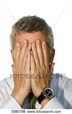 Man holding hands in front of face View Large Photo Image Stock Photo - Man holding hands in front of face . Fotosearch