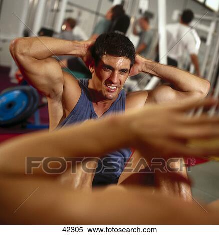 Stock Photography - Man in fitness studio . Fotosearch
