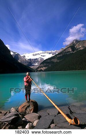 Man playing alpenhorn, Banff National Park, Alberta, Canada View Large Photo Image Stock Image - Man playing alpenhorn, Banff National Park, Alberta, Canada . Fotosearch