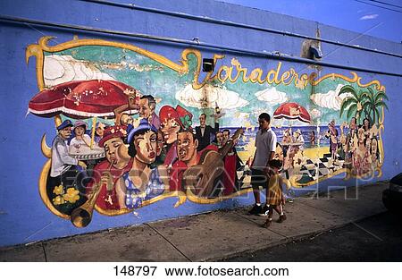 Man walking with girl in front of painted wall, Little Havana, Miami, Florida View Large Photo Image Stock Photo - Man walking with girl in front of painted wall, Little Havana, Miami, Florida . Fotosearch