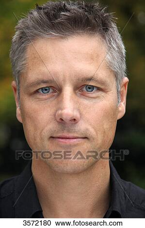 Man wearing black shirt outdoors, portrait View Large Photo Image Stock Image - Man wearing black shirt outdoors, portrait . Fotosearch
