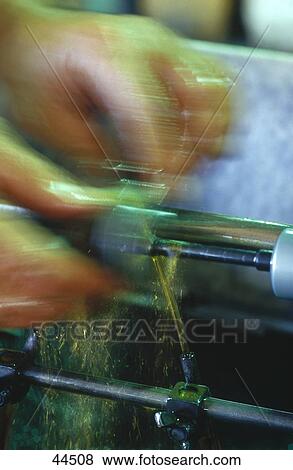 Stock Photo - Man working on drilling machine . Fotosearch