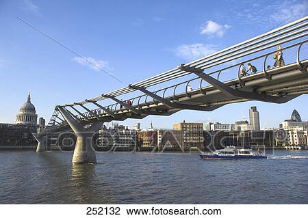 Millennium Footbridge across Thames River leading toward St Paul's cathedral, London, England View Large Photo Image Stock Image - Millennium Footbridge across Thames River leading toward St Paul's cathedral, London, England . Fotosearch