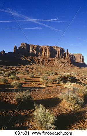 Stock Image - Mountains on arid landscape, Table Mountain, Monument Valley, San Juan County, Utah, USA . Fotosearch