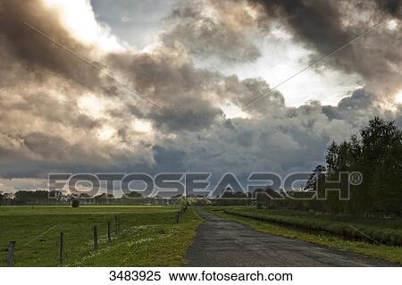 Stock Photography - Nimbostratus and pasture land, Lower Saxony, Germany, Europe . Fotosearch