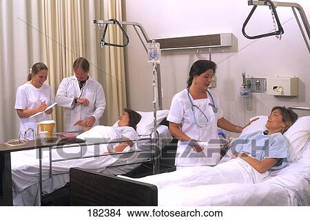 Nurse examining patients in hospital View Large Photo Image Picture - Nurse examining patients in hospital . Fotosearch