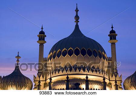 Stock Image - Onion domes lit up at night, Sussex, England . Fotosearch