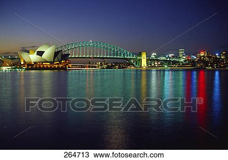 Opera house at waterfront, Sydney Opera House, Sydney Harbor Bridge, Sydney, New South Wales, Australia View Large Photo Image Stock Image - Opera house at waterfront, Sydney Opera House, Sydney Harbor Bridge, Sydney, New South Wales, Australia . Fotosearch