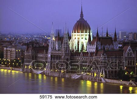 Stock Photography - Parliament building along river, Hungary, Europe . Fotosearch