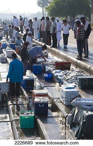 Stock Photo - People at fish market, Doha, Qatar . Fotosearch