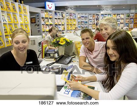 Stock Photo - People in travel angency . Fotosearch