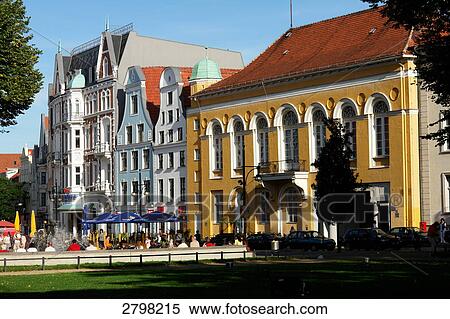 Stock Photography - People sitting at sidewalk cafe, Rostock, Mecklenburg-Western Pomerania, Germany . Fotosearch