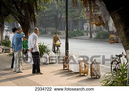 People standing at roadside, Guangzhou, Guangdong Province, China View Large Photo Image Stock Image - People standing at roadside, Guangzhou, Guangdong Province, China . Fotosearch