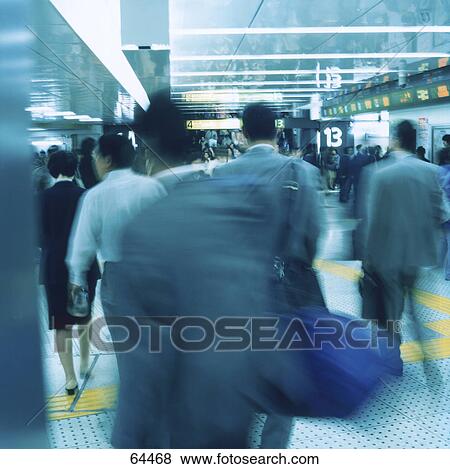 Stock Photo - People walking in subway station . Fotosearch