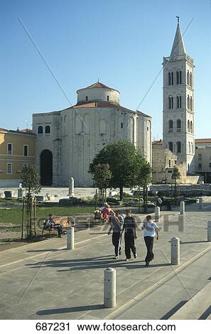 People walking on street with church in background, St Donatus, Zadar, Croatia View Large Photo Image Stock Image - People walking on street with church in background, St Donatus, Zadar, Croatia . Fotosearch