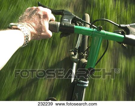 Person riding bicycle View Large Photo Image Stock Photo - Person riding bicycle . Fotosearch