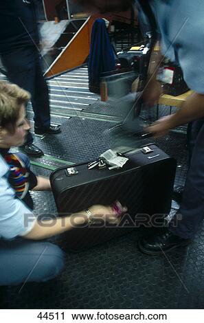 Police checking baggage at airport View Large Photo Image Stock Image - Police checking baggage at airport . Fotosearch