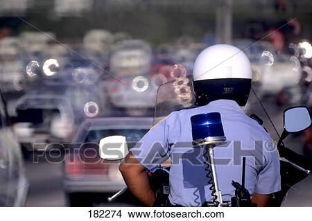 Policeman riding motorcycle View Large Photo Image Picture - Policeman riding motorcycle . Fotosearch