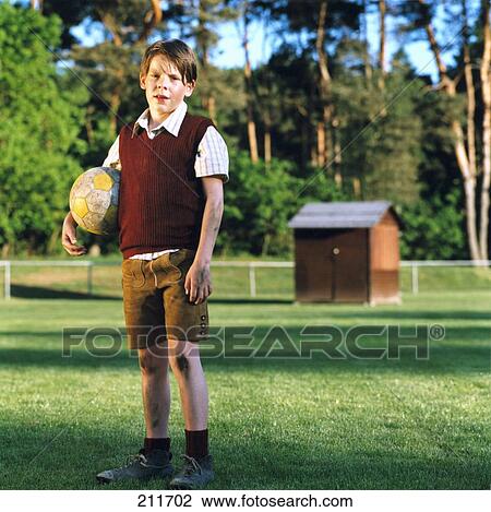Portrait of boy holding soccer ball View Large Photo Image Stock Image - Portrait of boy holding soccer ball . Fotosearch