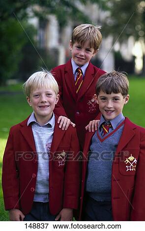 Portrait of three boys smiling in school uniform, England View Large Photo Image Stock Photo - Portrait of three boys smiling in school uniform, England . Fotosearch
