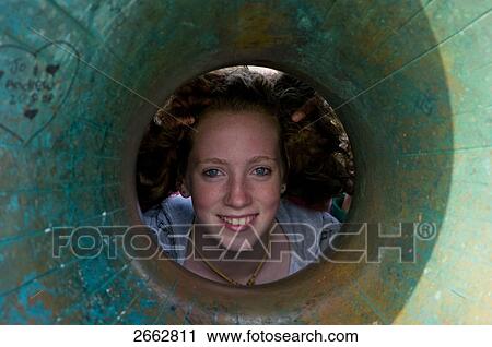 Portrait of woman looking through tube View Large Photo Image Stock Image - Portrait of woman looking through tube . Fotosearch